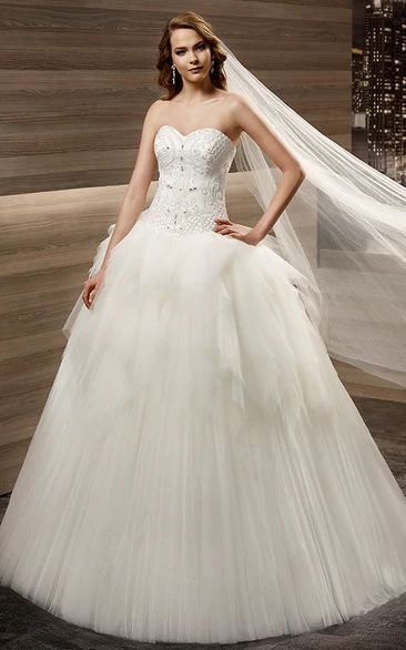 Sweetheart A-line Wedding gown with Appliques Bodice and Asymmetrical Peplum