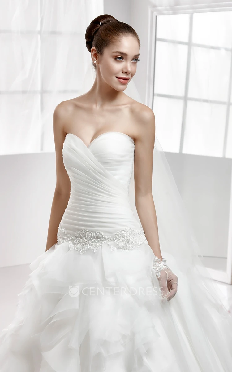 Sweetheart Beaded Wedding Gown With Cascading Ruffles and Pleated Bodice