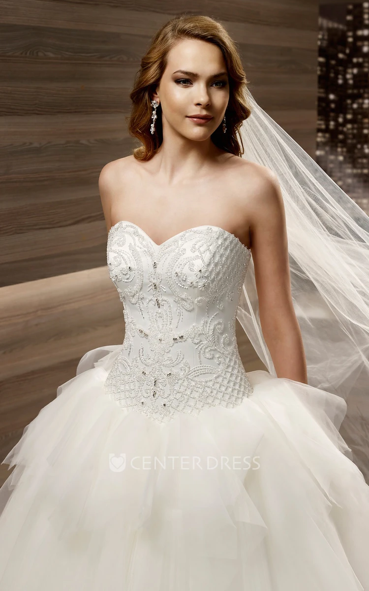 Sweetheart A-line Wedding gown with Appliques Bodice and Asymmetrical Peplum